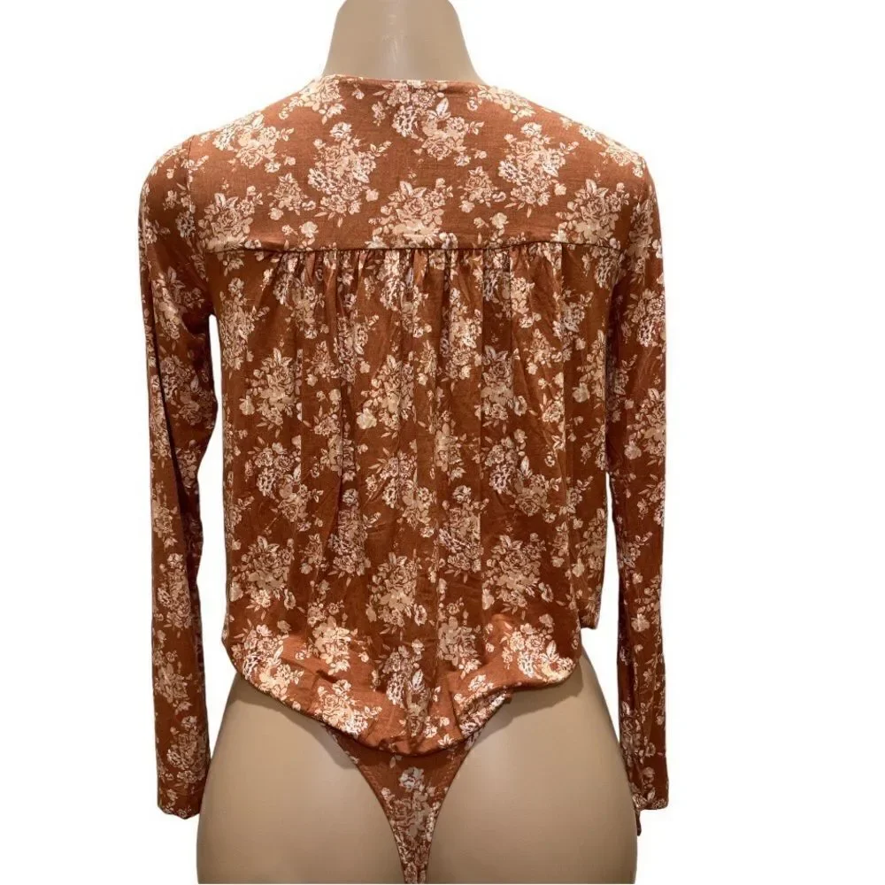 NWT-FREE PEOPLE Turnt Bodysuit